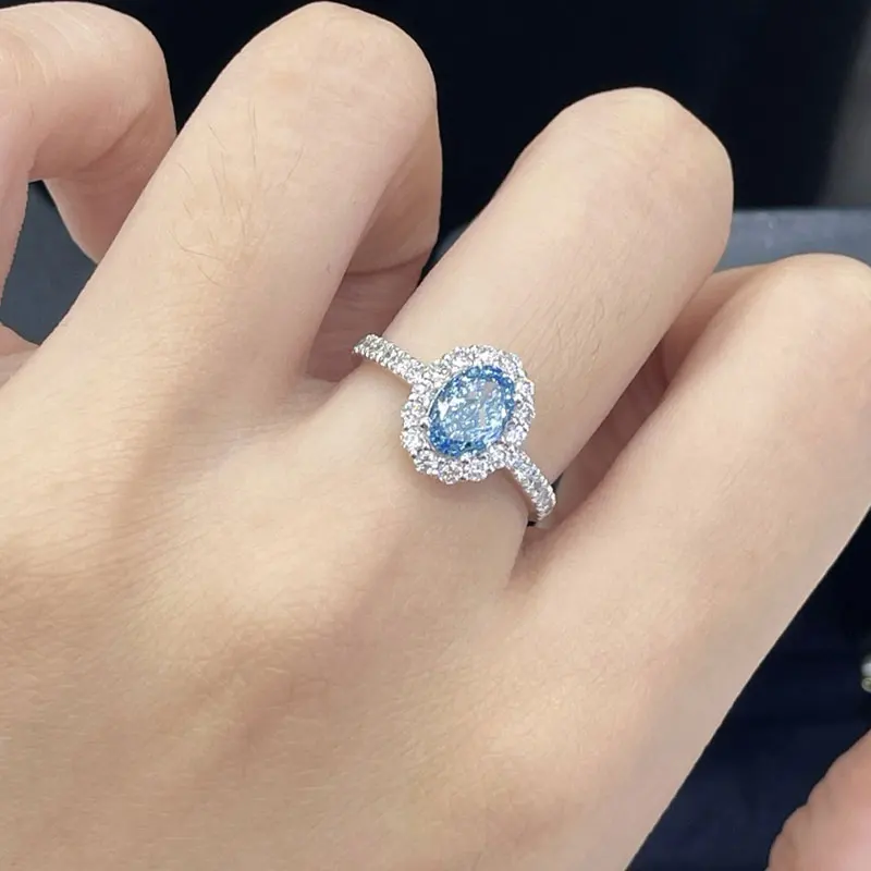 

Настраиваемое обручальное кольцо из белого золота 14 карат с овальным выращенным в лаборатории синим бриллиантом 1 карат и двойным ореолом для женщин, с сертификатом