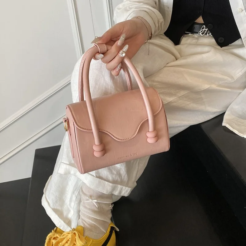 

Elegant Women Bag With Frame Closure And Top Handle Made From Exotic Embossed Leather For Luxury Fashion