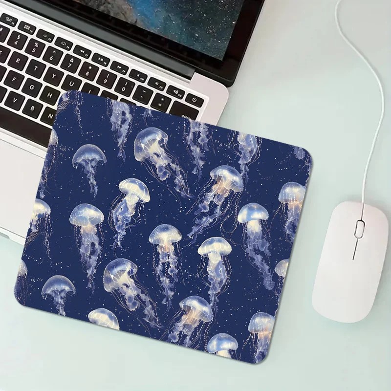 

The jellyfish printed mouse pad with an anti-slip rubber base and portable office desk pad is suitable for gamers and home use