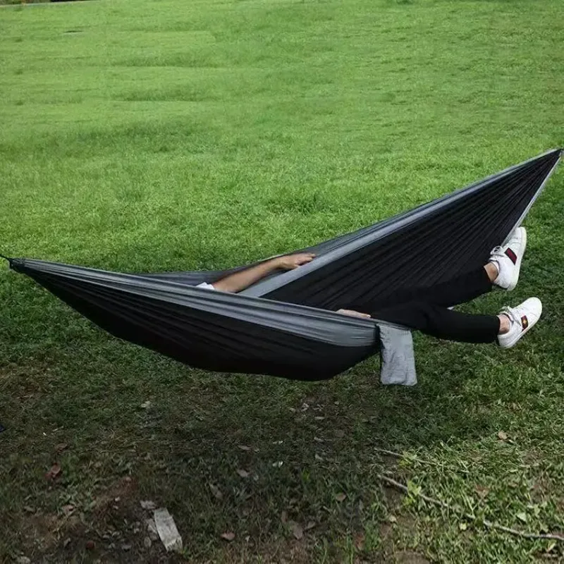 Best-selling outdoor camping hammock with multi-color design and included tie ropes. Camping swing.