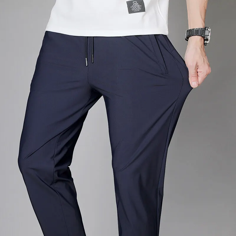 

2024 New Casual Trendy Men's Solid Color Elastic Pocket Spring Versatile Slim Fit Ice Silk Breathable Sports Casual Pants