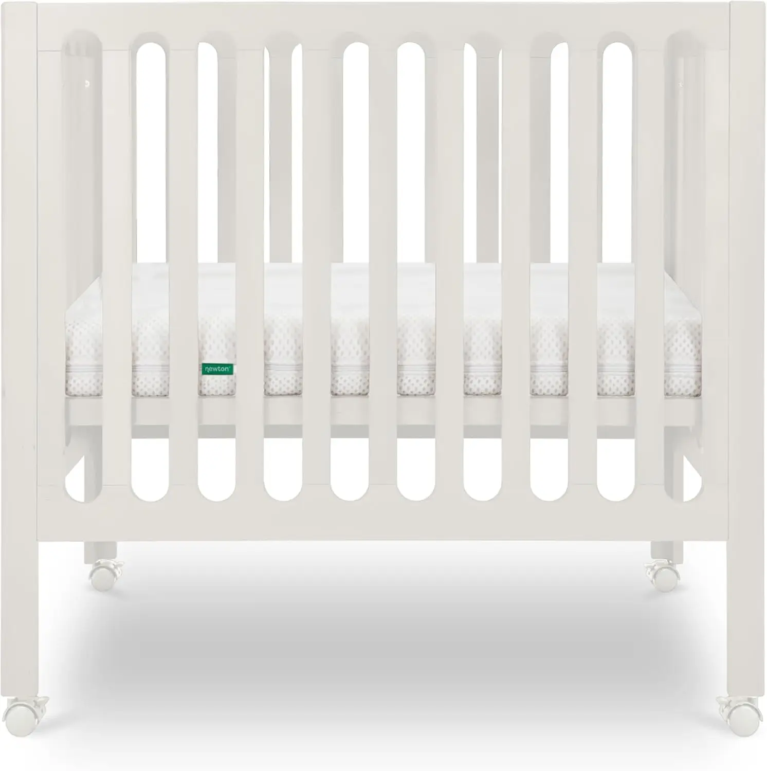 Newton Baby Galileo Mini Crib من خشب الزان الصلب مع عجلات باللون الأبيض الدافئ، مرتبة سرير صغيرة متضمنة