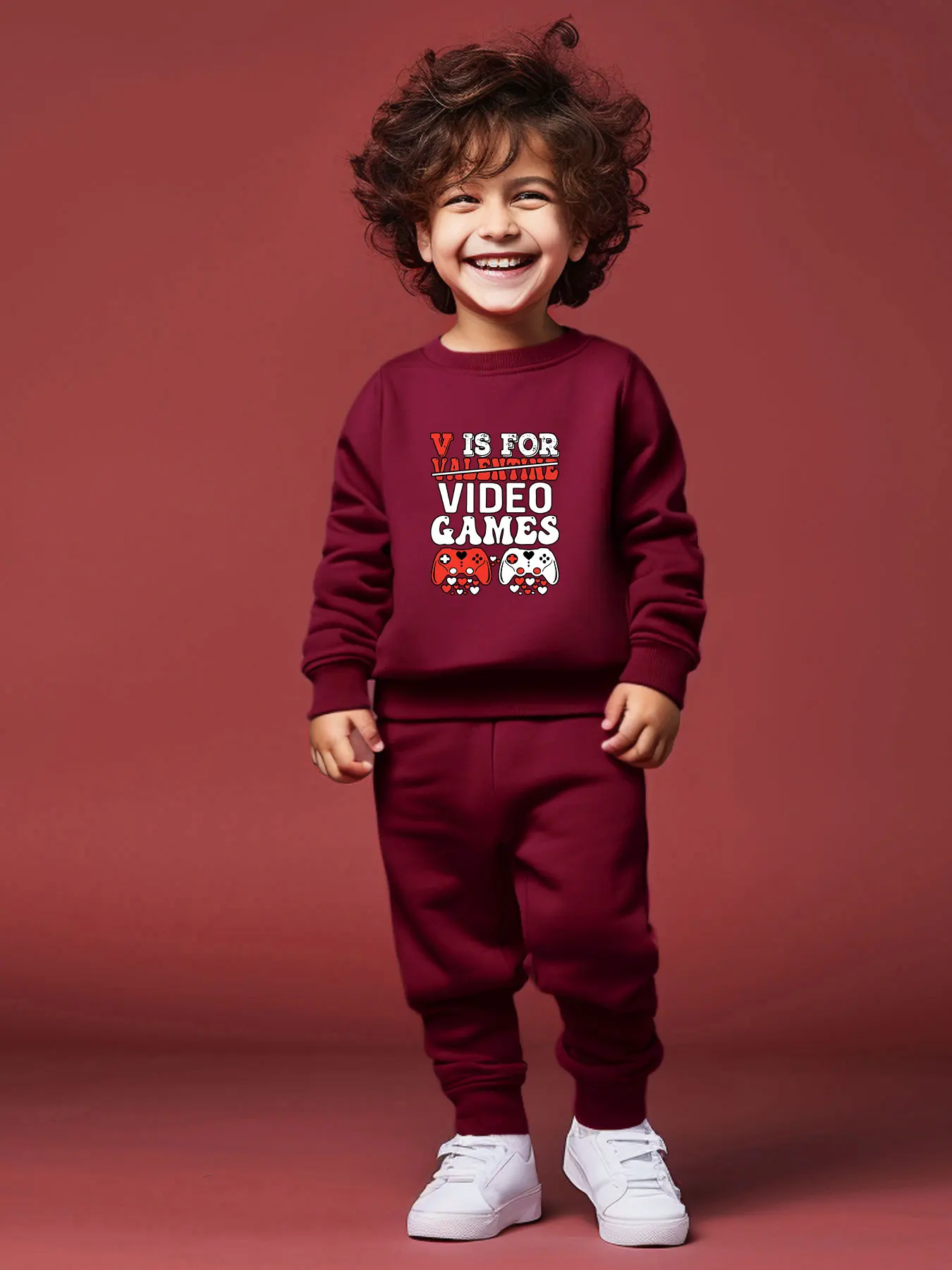 

Boys' fashionable casual round neck long sleeved jumpsuit, heart-shaped game handle letter printed round neck top with pants