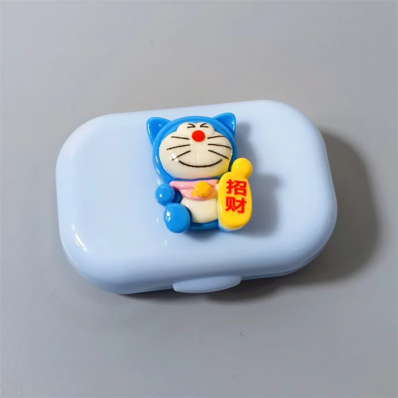 Doraemon Robot Cat Contact Lens, banc de boîte d'acceptation, dessin animé, bref, portable, compact, chanceux, richesse, article mignon, nouveau, 2024