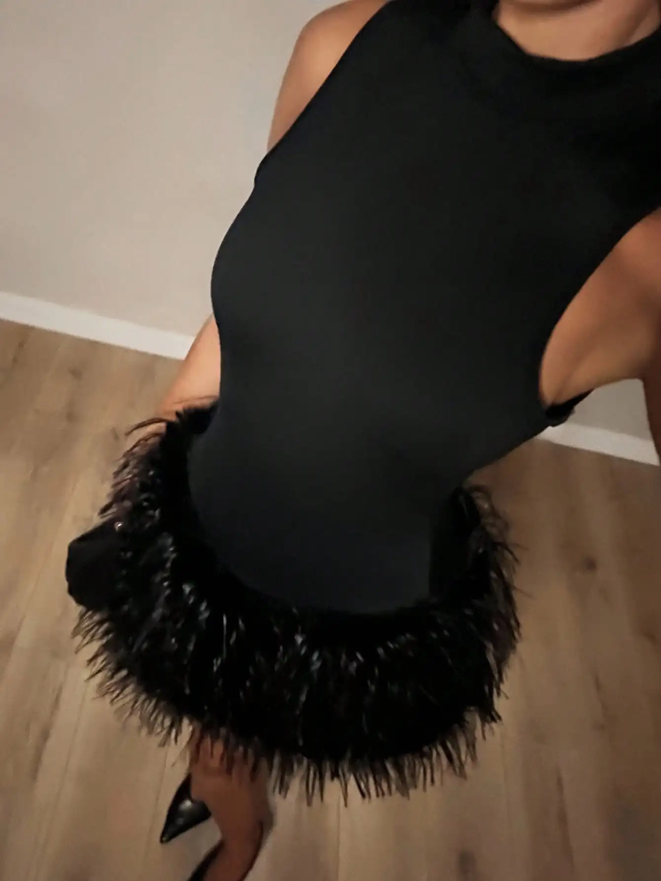 

Charm The Lady Attended The Halloween Party Wearing A Mysterious Dark Black High-Necked Fur-Trimmed Dress.Elevated Elegance