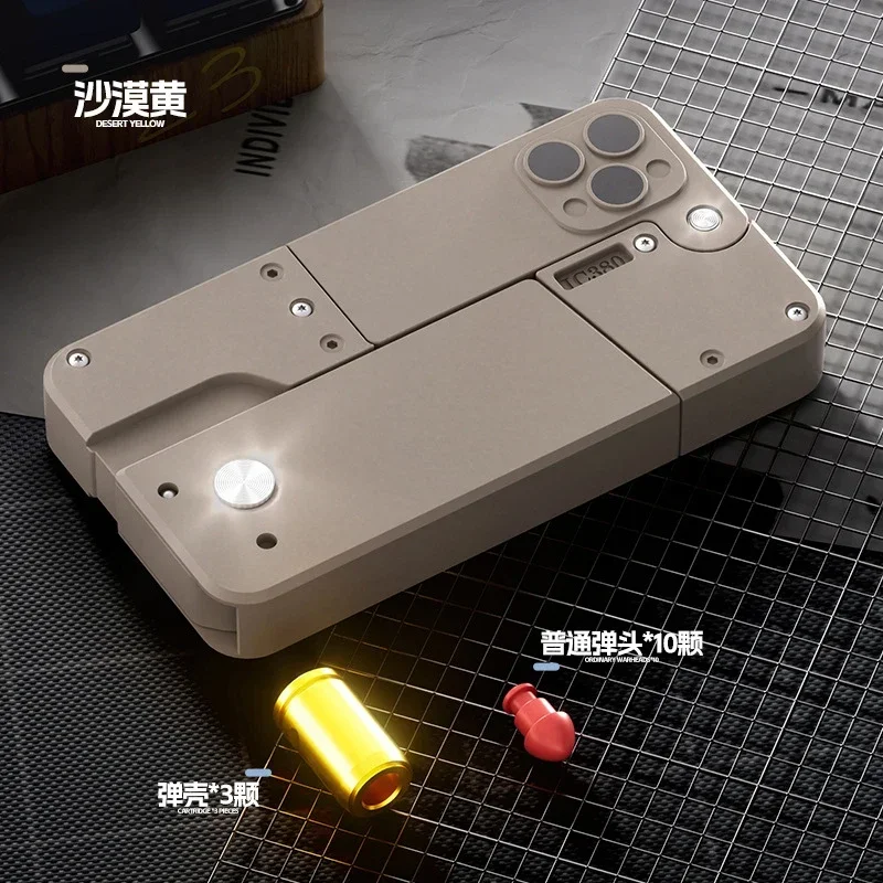 2025 Shell Espulsione Deformazione Ic380 Pieghevole Pistola a spruzzo per telefono cellulare Pistola a proiettile morbido Può lanciare la pistola giocattolo Modello Regalo di Natale