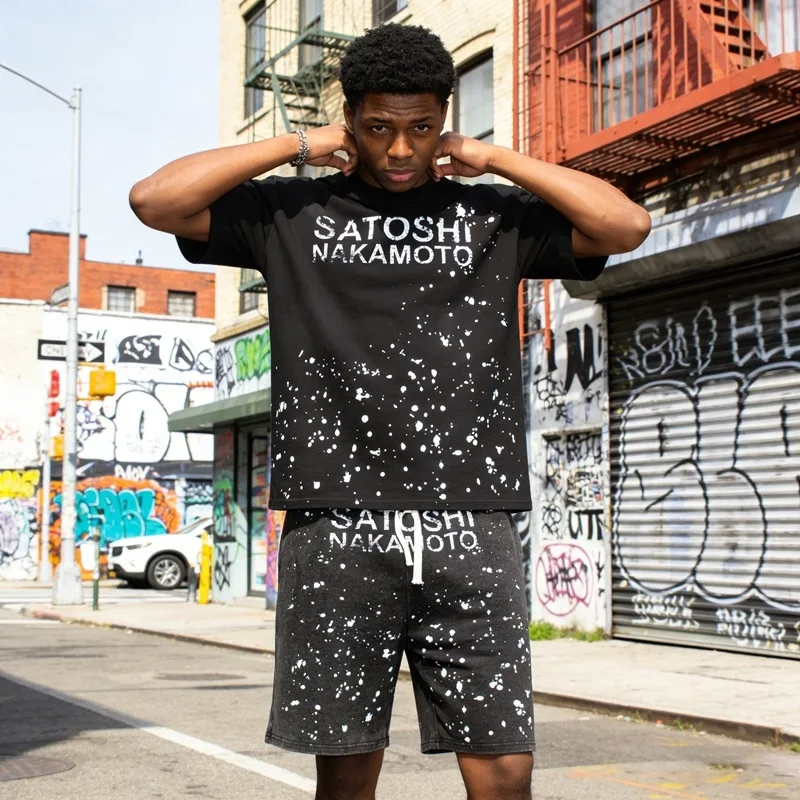 Satoshi Nakamoto's ink-stained vintage letter-patterned washed and distressed five-inch short pants