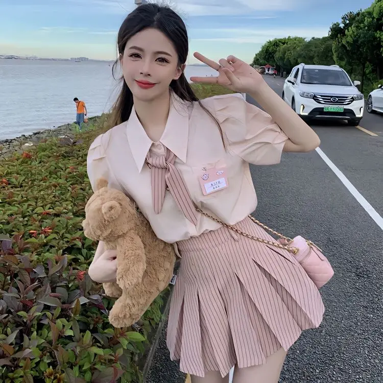 

College Sweet Pink Jk Униформа Костюм Женская Рубашка с короткими рукавами-фонариками Тонкая плиссированная юбка с высокой талией Летний корейский комплект из трех предметов