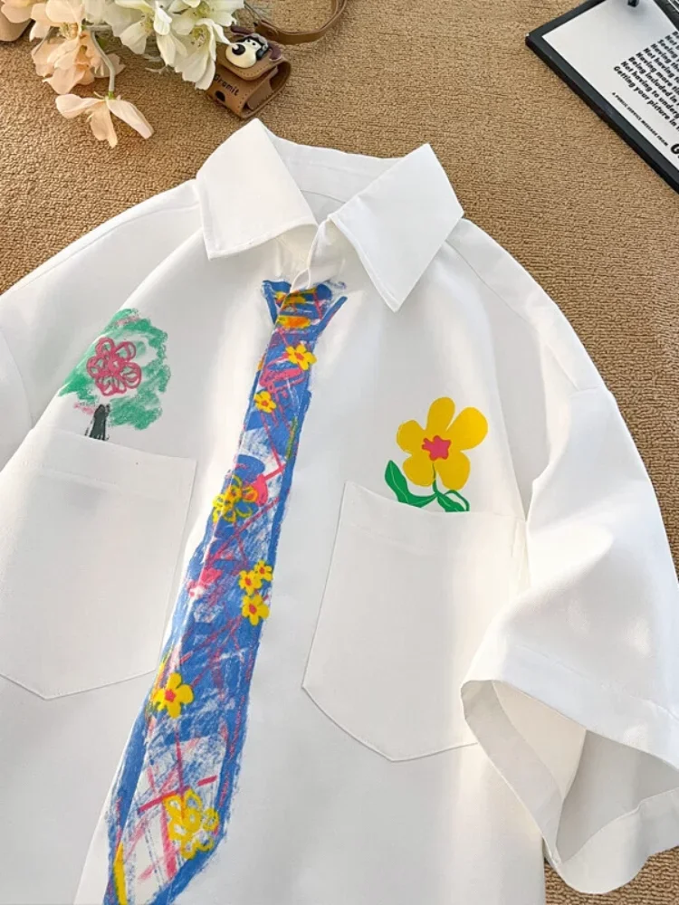

Korean Y2K Brand Cartoon Graphic Short Sleeve Button Up Shirts Crayon Tie Printed White Blouse Coats Couples Men Women Fun Top