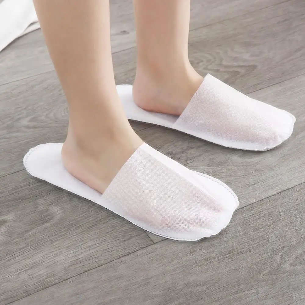 

Одноразовые тапочки унисекс из нетканого материала для отелей, нескользящие домашние тапочки для гостей, один размер, мягкие гостиничные тапочки для душа