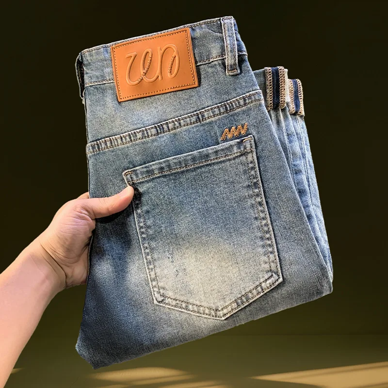 Nine point ripped denim jeans for men in the summer of 2025, thin and trendy brand retro washed, narrow leg elastic denim pants