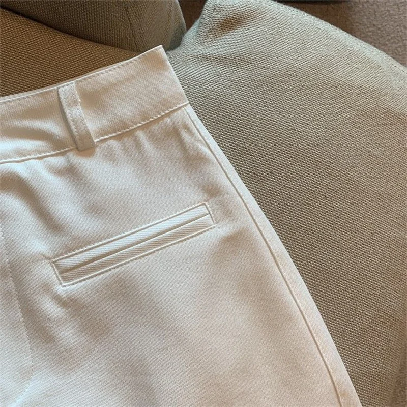 تنانير قصيرة مثيرة للسيدات على الموضة لعام 2025 تنورة غمد ملفوفة على الورك للربيع والصيف عالية الخصر للسيدات غير رسمية تنانير على شكل حرف a