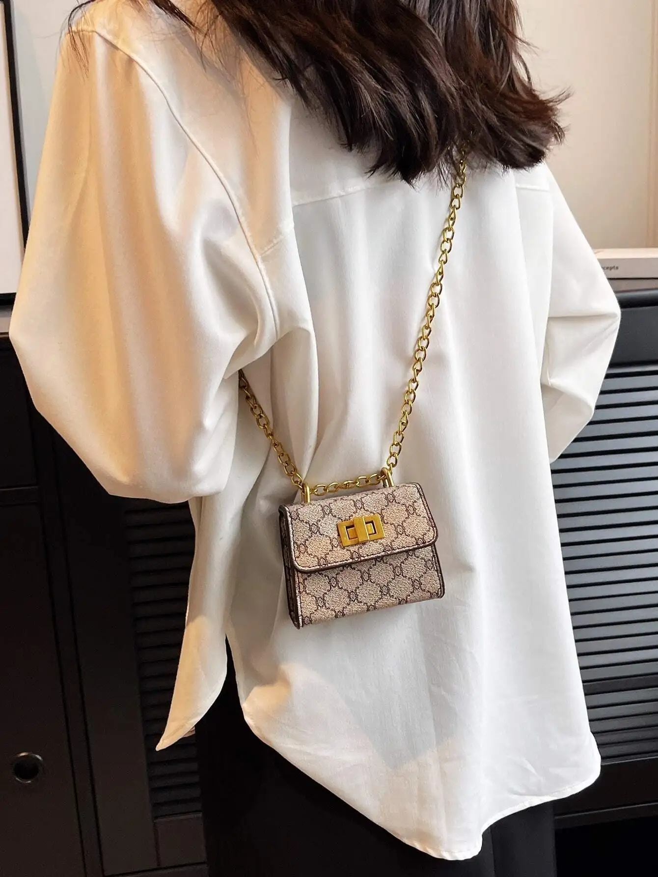 

Mini Square Crossbody Bag with Geometric Print and Gold Chain Strap