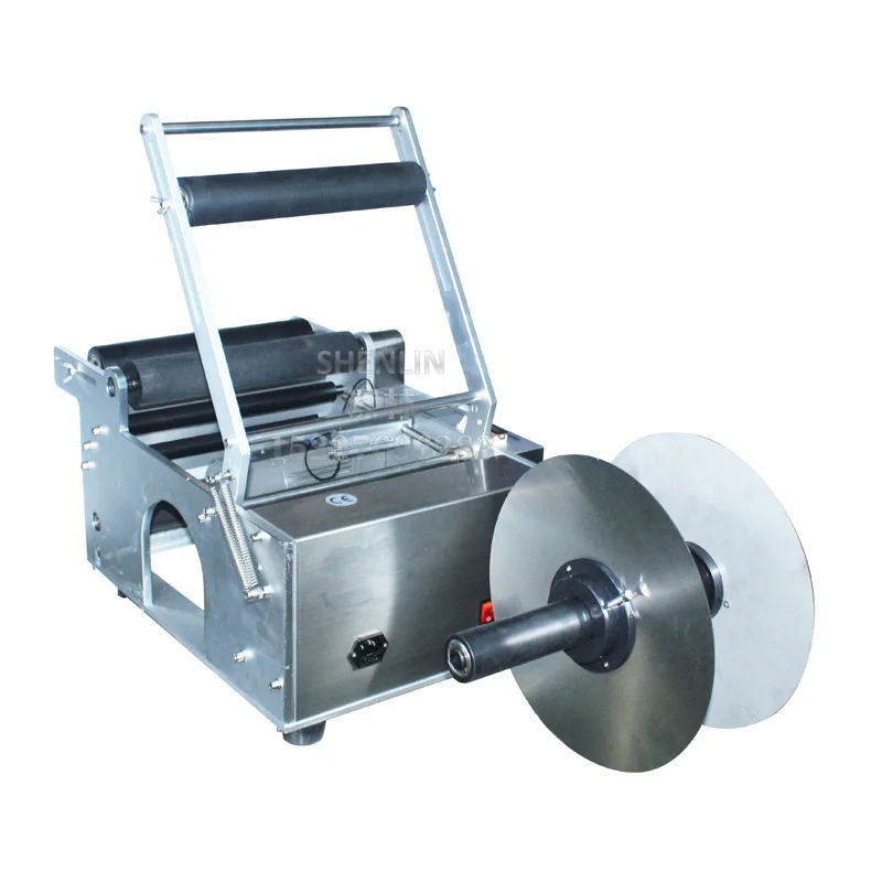 

Semi-automatic labelling machine, table-top label sticker, brand applicator LT50, for round bottle labeller