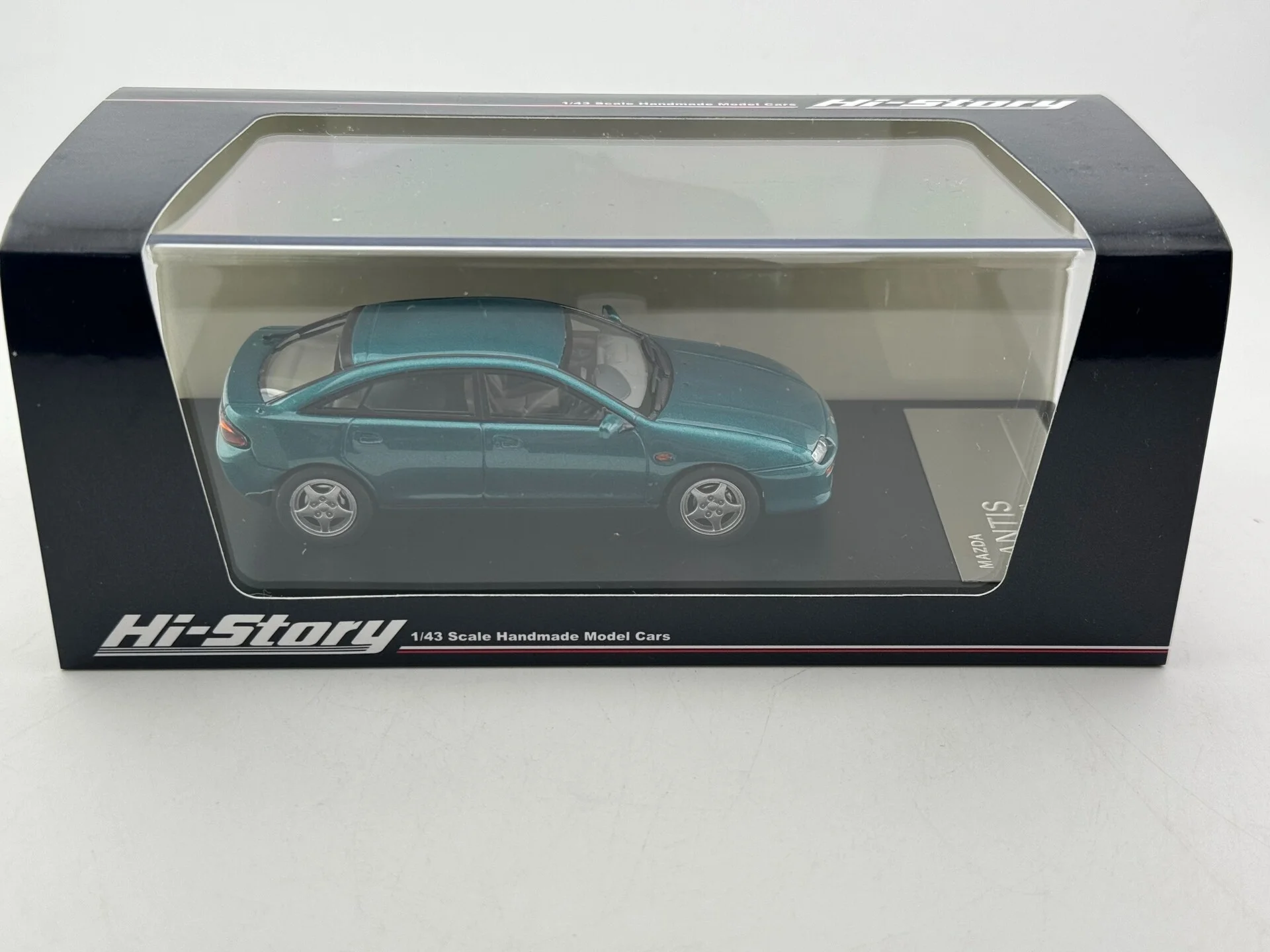 

Модель автомобиля Mazda Lantis из смолы в масштабе 1/43 от Flaws Hi Story
