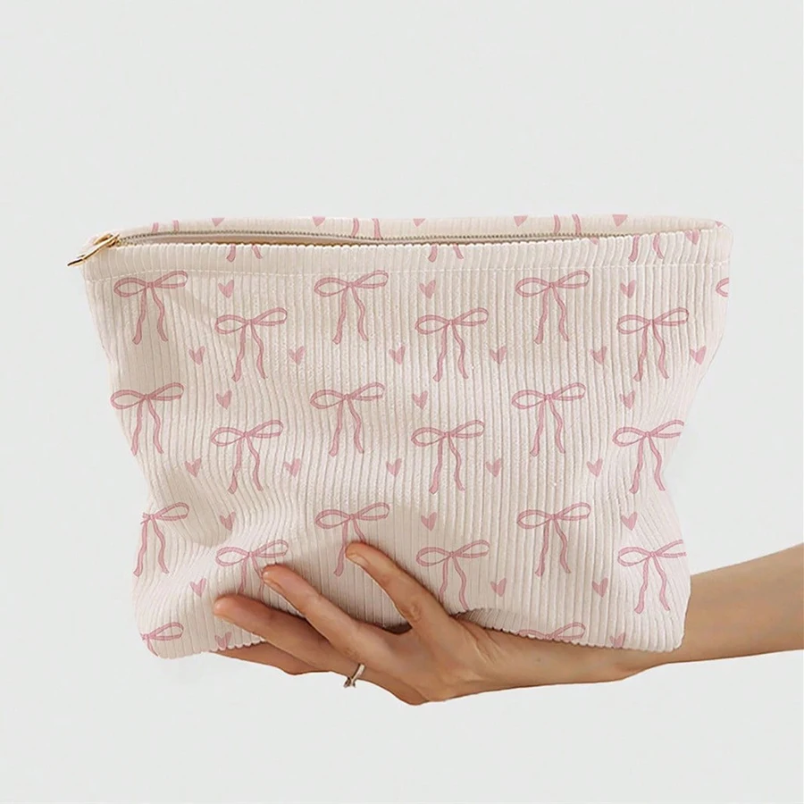 Tas makeup korduroi dengan ritsleting bermotif pita merah muda yang dirancang secara minimalis, tas penyimpanan kosmetik yang ringan dan multifungsi