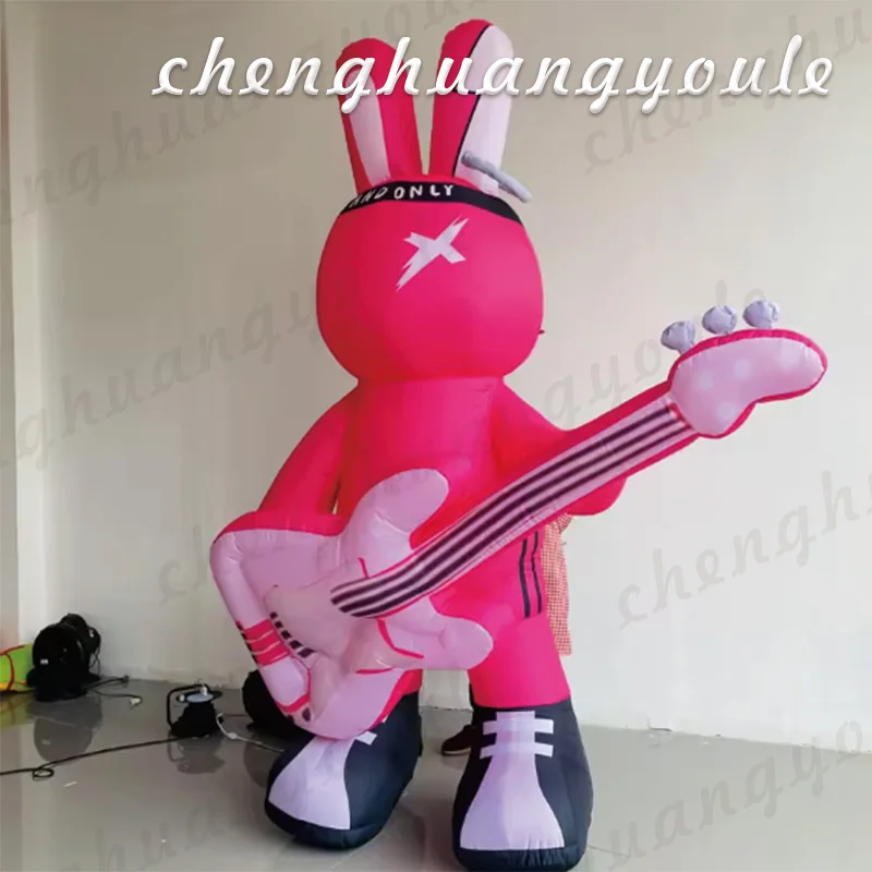 

Inflatable rabbit air model with white LED lights holding guitar pink rabbit mall decoration propaganda drainage