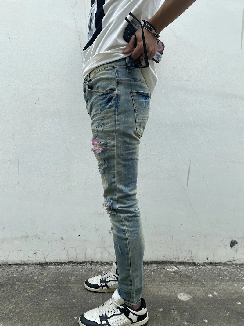 Zerstörte zerrissene Löcher Patckwork Denim Jean Herren lässig Distressed gewaschene Biker Jeans neue Mode High-Street schlanke Hosen Jogger