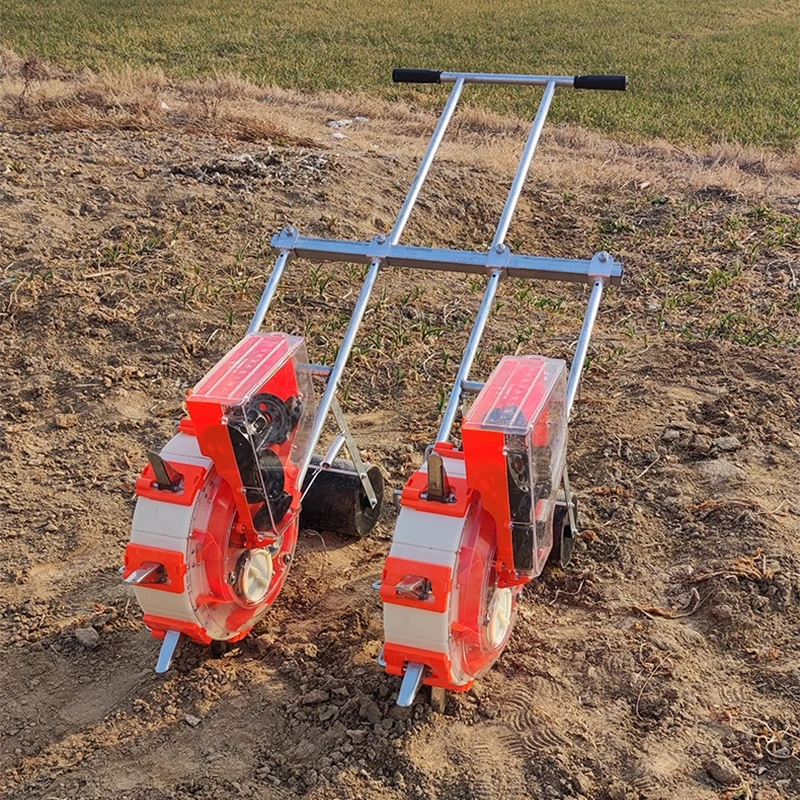 بذارة دفع يدويا صف مزدوج الذرة الفول السوداني أرز فول الصويا بذور اللفت متعددة الوظائف بذارة زراعية صغيرة الآلات الزراعية