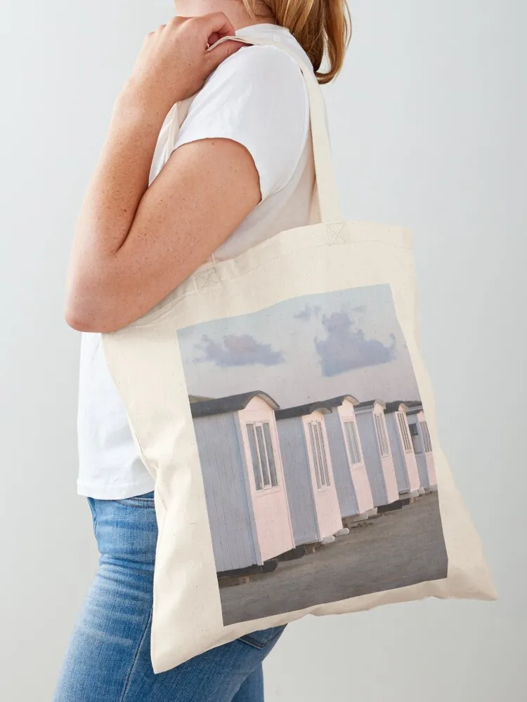 

White beach huts on the golden sand at sun set Tote Bag Women bags bags for women bags luxury women