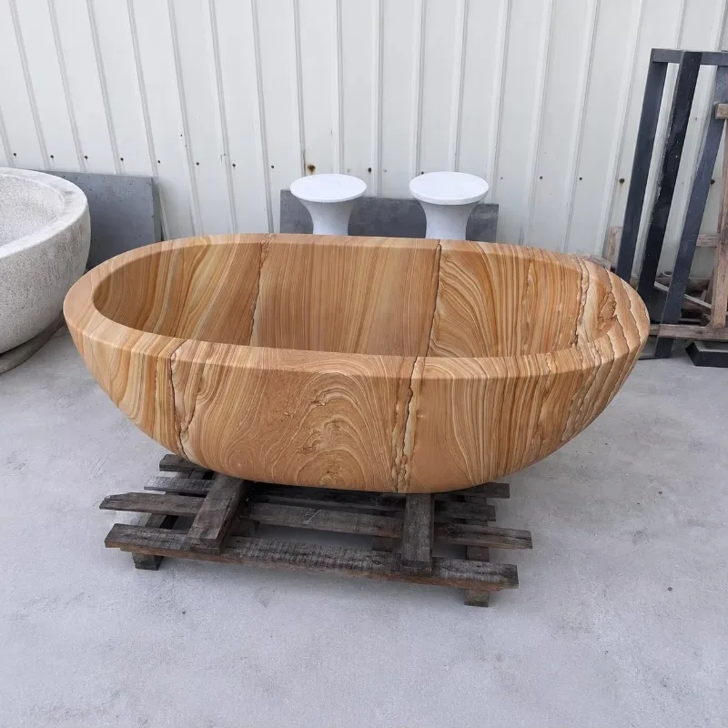 Wholesale China Bathtub Hand Carved Natural Yellow Wood Grain Sandstone Free Standing Vintage Bathtub Freestanding Soaking Tub