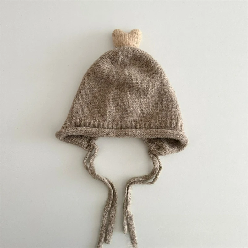 Topi Rajut Korea Gaya Musim Gugur dan Musim Dingin dengan Warna Solid, Tali, Pelindung Telinga, dan Topi Wol Hangat Bergaya untuk Anak-anak.