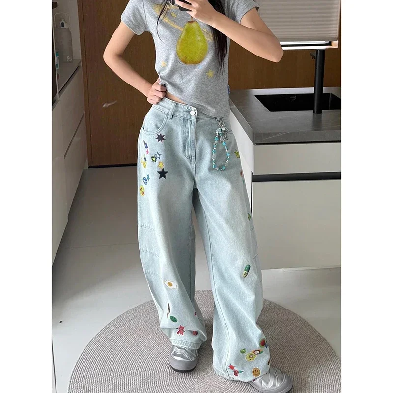 กางเกงยีนส์ทรงหลวมพิมพ์ลายการ์ตูนสีน้ำเงินวินเทจ สไตล์ Y2K สำหรับผู้หญิง ฤดูใบไม้ร่วง 2025 สไตล์ฮาราจูกุ ขากว้าง เอวสูงทรงโอเวอร์ไซส์ ยุค 2000
