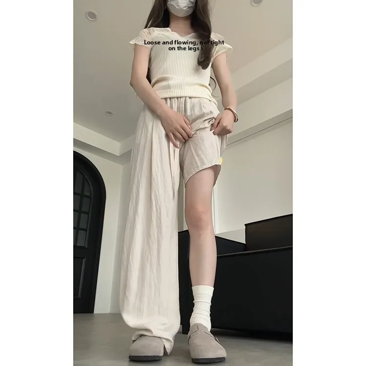 กางเกงลำลองผ้าลินินสไตล์เกาหลีสำหรับผู้หญิง รุ่นใหม่สำหรับฤดูร้อน เนื้อผ้าเบาสบาย ระบายอากาศได้ดี ทรงหลวม ช่วยให้ดูผอมเพรียว ยาวคลุมเท้า