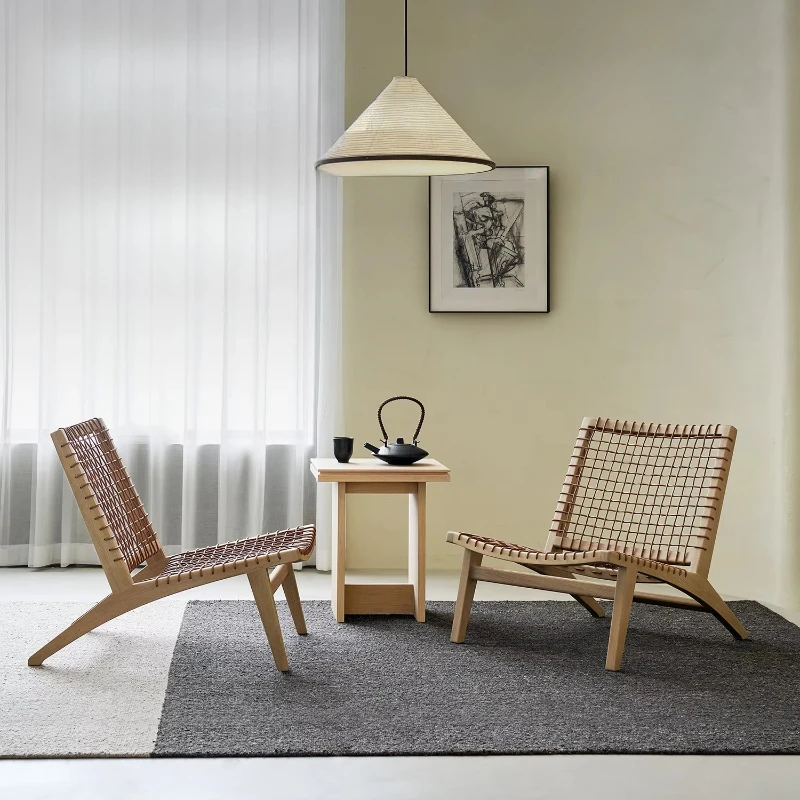 

The leisure chair has beautiful craftsmanship, cowhide rope rattan solid wood log wabi-sabi single ergonomic design