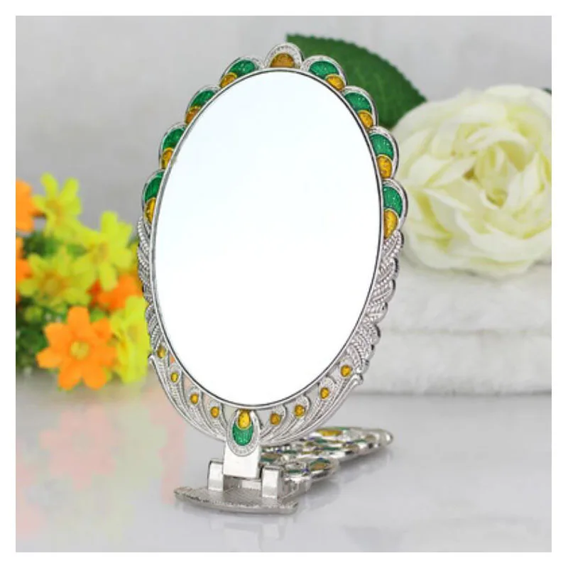 High quality desktop cosmetic princess lens portable handle can fold and hold a vintage peacock imitation copper mirror