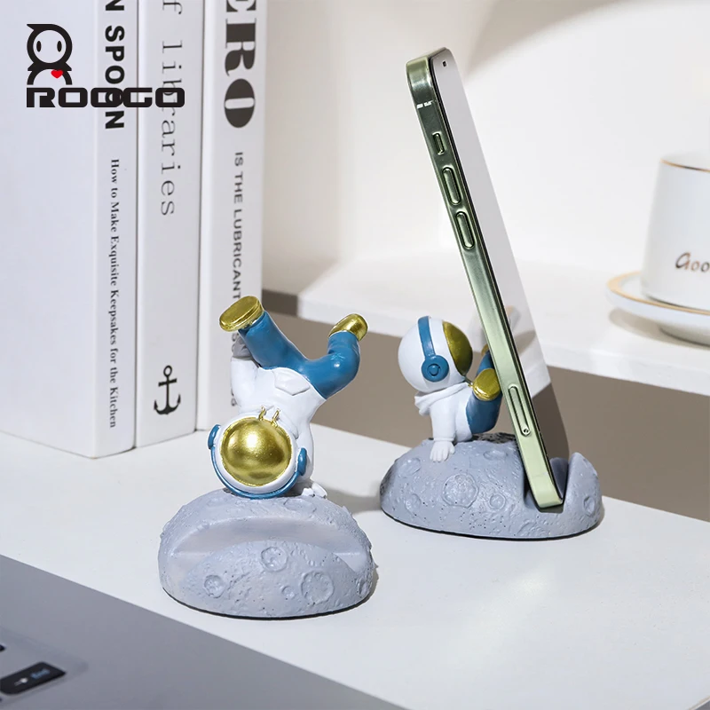 ROOGO New Hip Hop Astronaut Sculpture Small Creative Space Phone Holder for Desk Resin Astronaut Figurines Miniature Home Decor