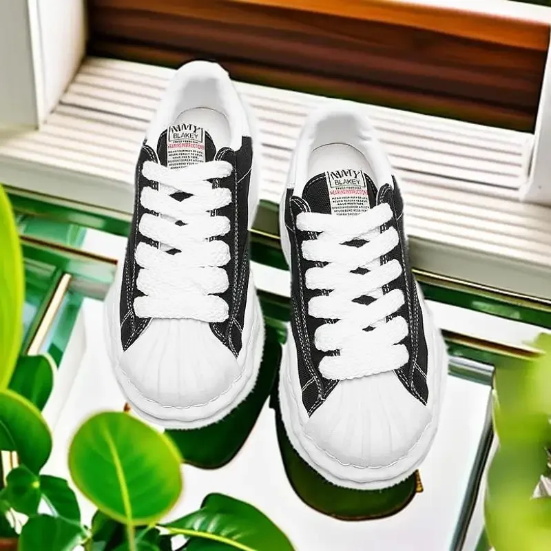 Eenvoudige en sfeervolle leren canvasschoenen en veelzijdige, ademende, comfortabele casual sportschoenen