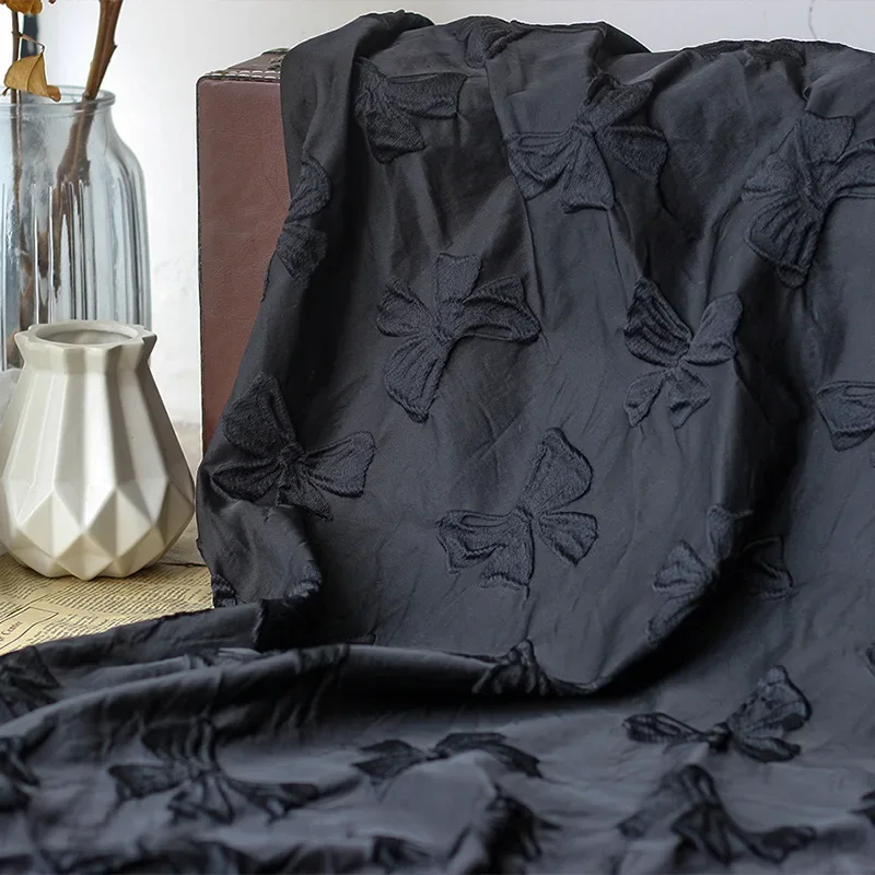 

Black Bow Embossed Yarn Dyed Jacquard Fabric Stiff Polyester Autumn and Winter Jacquard Dress Fabric