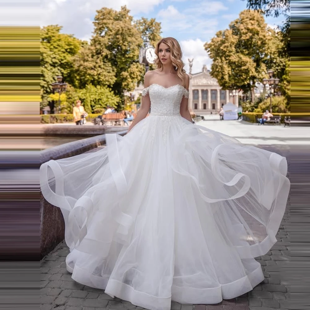 2025 Al largo della spalla A-Line Abiti da sposa da donna Moderni applicazioni di pizzo Abiti da sposa Ball Princess Vestido Novia Boda Personalizzato