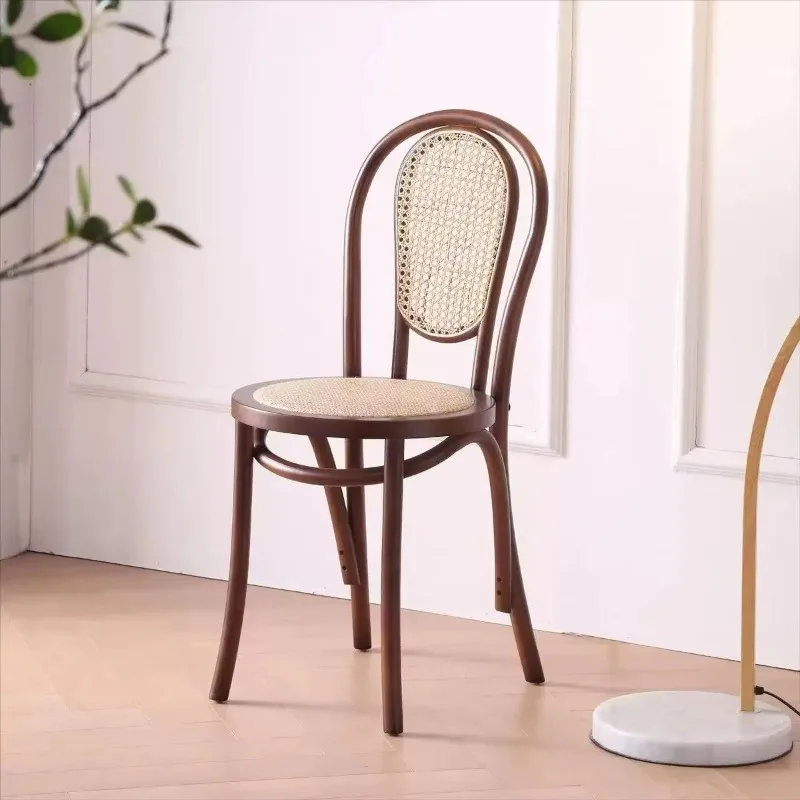 Hot-selling retro solid wood dining chairs with rattan-woven backrests, suitable for tea shops and cafés.
