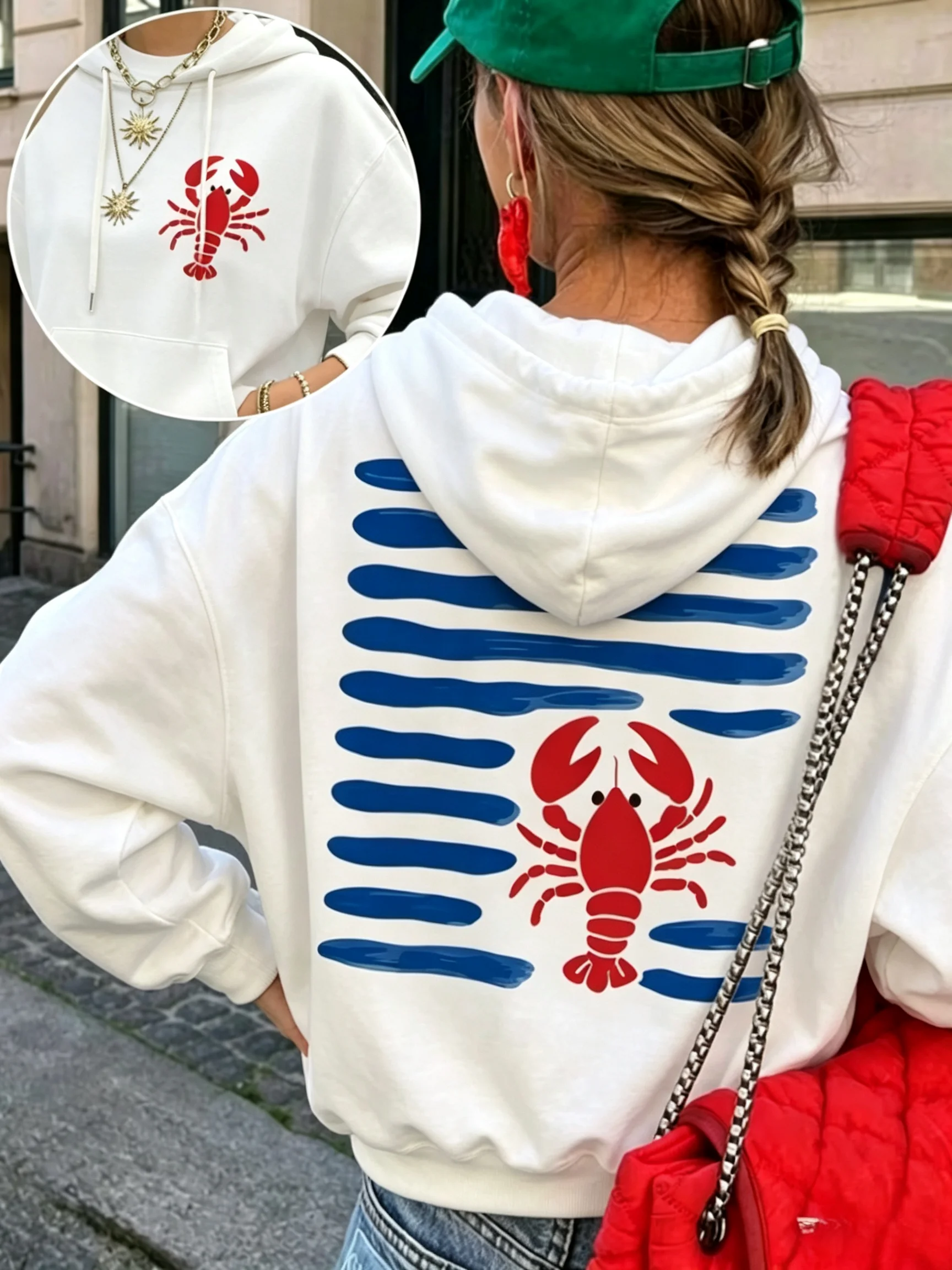 Coastal lobster and shell print t-shirt with blue wave pattern long-sleeved top. Women's casual relaxed street style daily wear