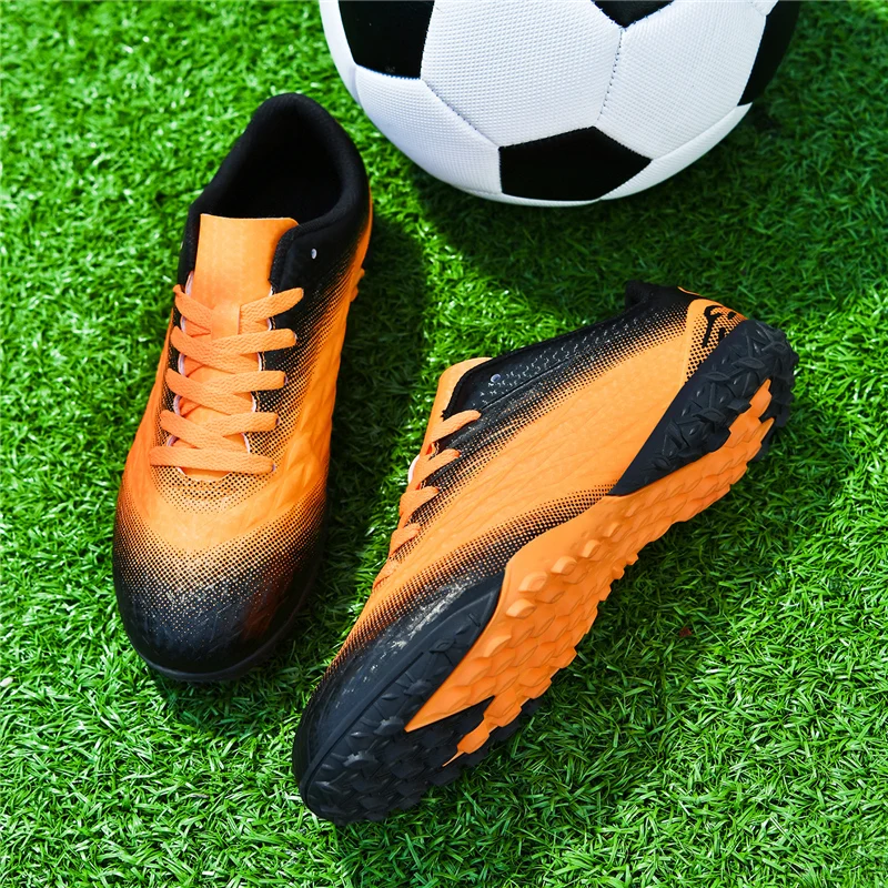 A pair of children's lightweight breathable turf soccer cleats, shock absorbing sole outdoor match sports shoes YZ-L007