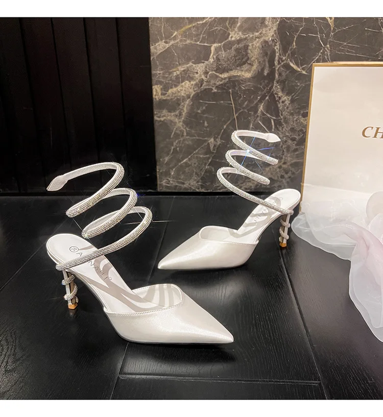 Baotou sandals for women in summer, sexy snake shaped wrapped rhinestone suede pointed high heels, white satin wedding shoes