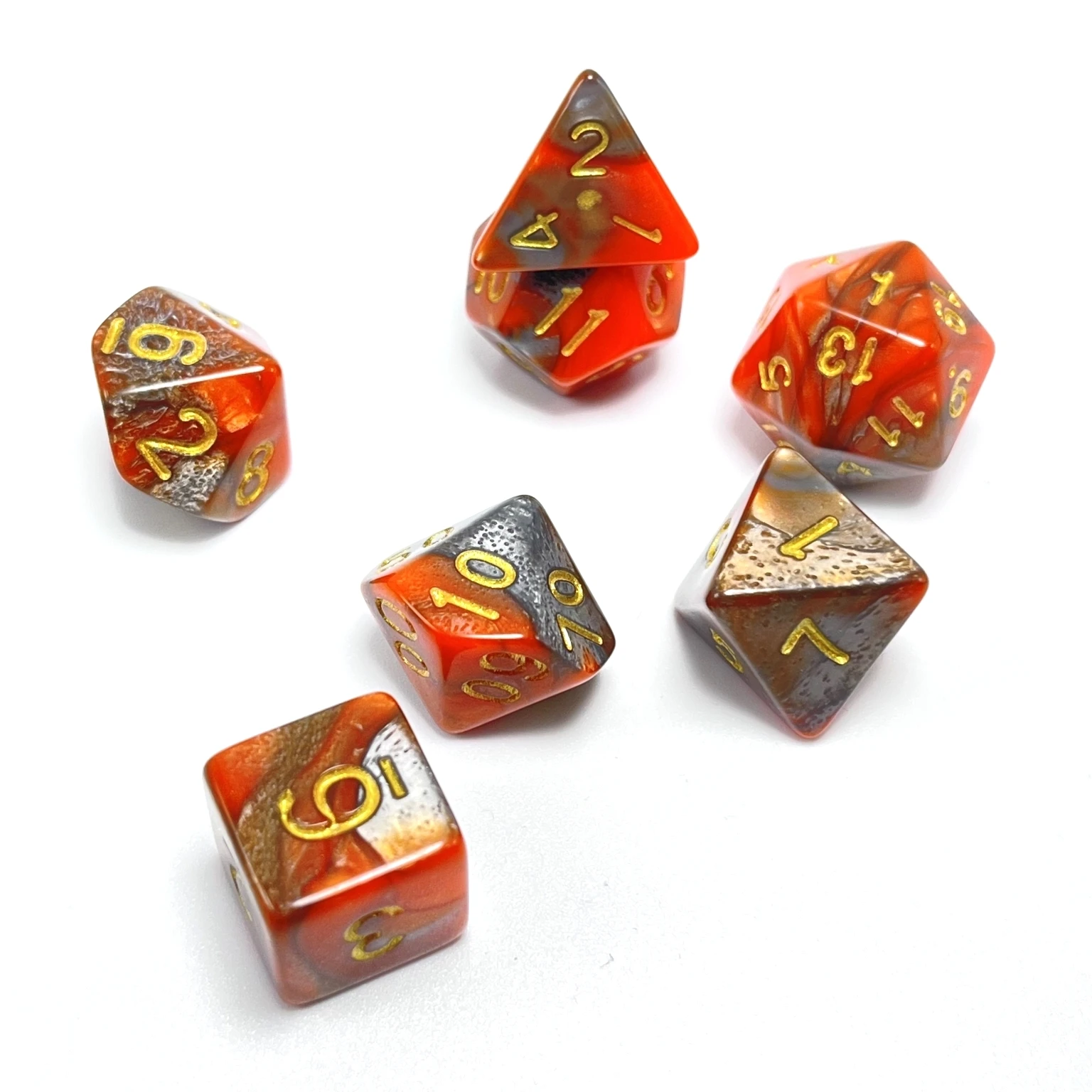 A set of 7 orange silver with gold lettering unleashing your inner warrior polyhedral dice game