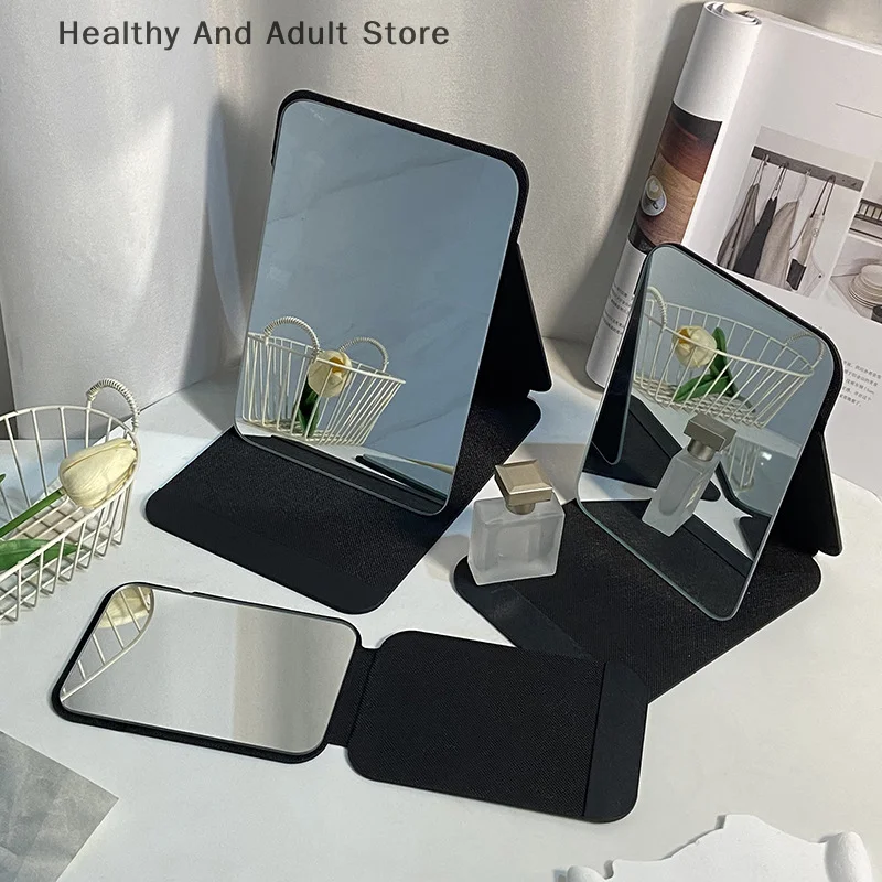 Desktop-Make-up-Spiegel, einfarbig, PU-Leder, einfacher tragbarer schwarzer Handspiegel, faltbar, für Studenten, kompakt, niedlicher Taschenspiegel