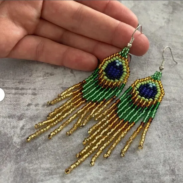 Beaded earrings Tassel Hand knitting Peacock feather Bohemia Design Alloy Tide Simple Rice bead earrings