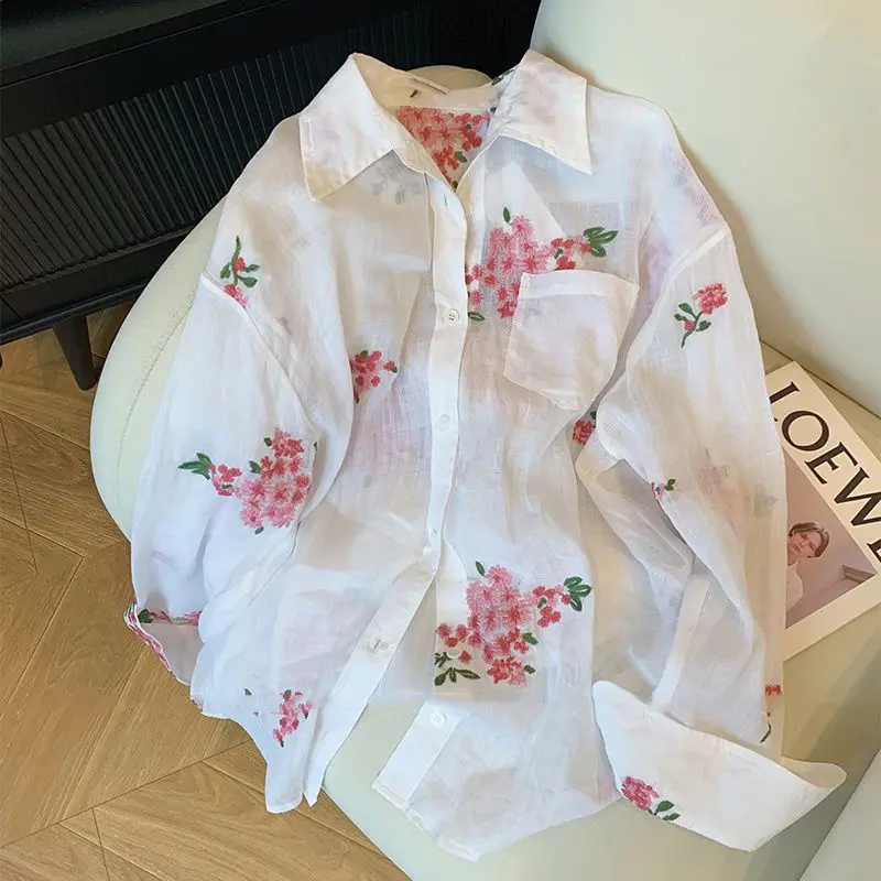 

Elegant Floral Embroidery Lapel Neck Shirt Women Summer Simple Long Sleeve Sun Protection Coat 2025 New Single Breasted Blouses