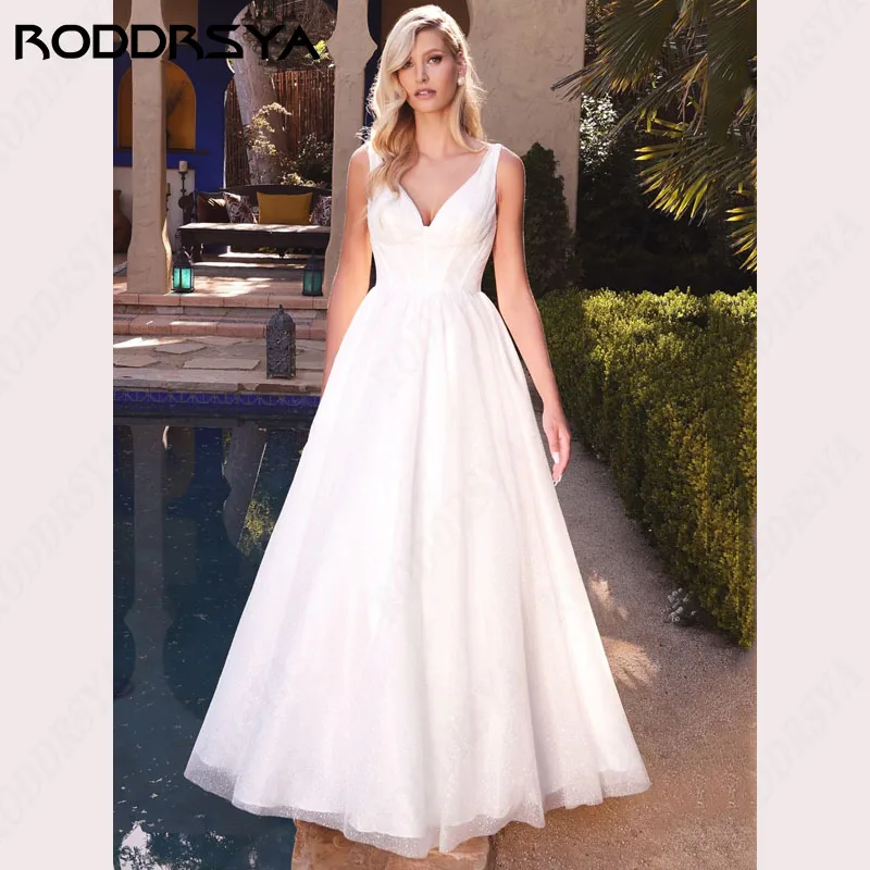 RODDRSYA Brilhante Tule Vestidos De Casamento Sexy Brilhante Decote Em V A linha Свадебное платье Bolso Inserível Sem Mangas Festa De Noiva Brilhante Tule Vestidos De Casamento Sexy Brilhante Decote Em V A linha Свадеб