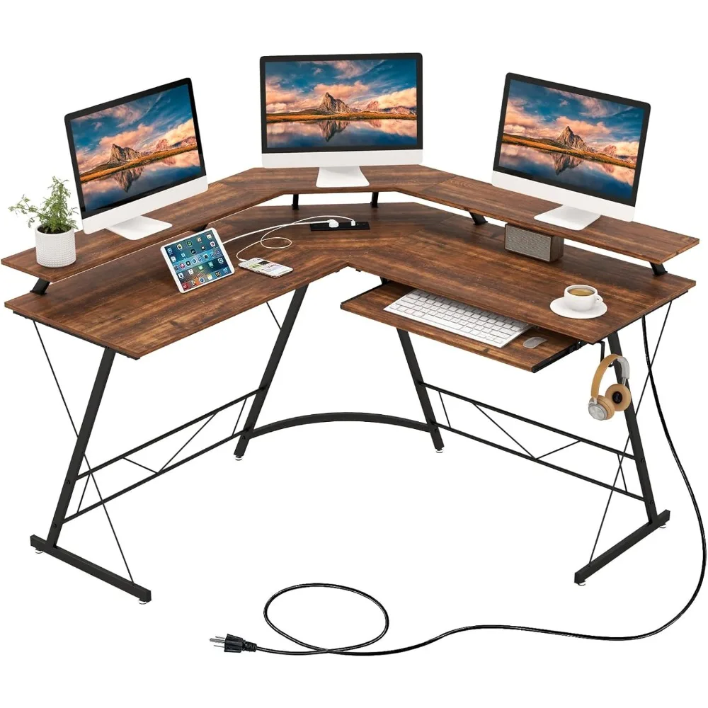 

L-shaped computer desk with power socket, monitor stand, keyboard tray, and headphones