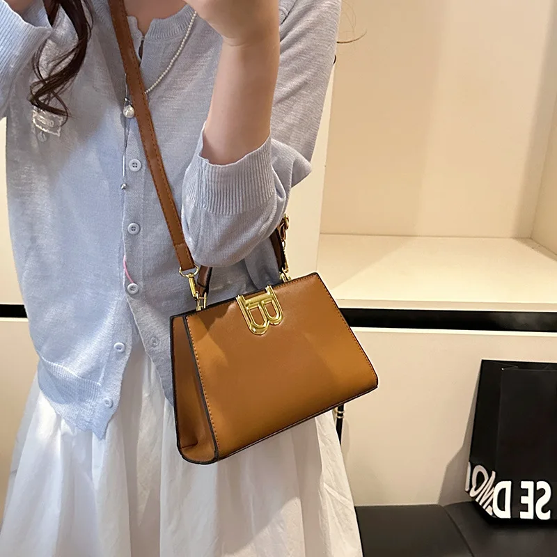 ​​Artisan Crafted Geometric Saddle Bag Women Textured Leather Crossbody Purse Museum Lunch Date Ready Statement Style Luxury