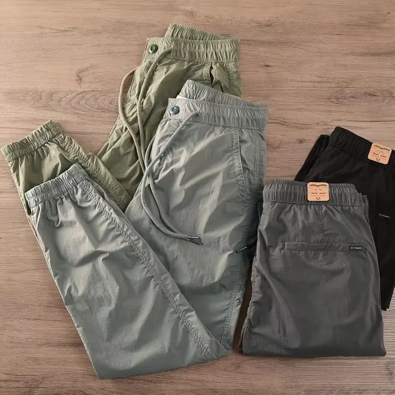 Pantaloni leggeri con risvolto elastico qui-dry Abbigliamento sportivo da uomo a vita sottile Abbigliamento da lavoro casual Protezione del lavoro Pantaloni lunghi resistenti all'usura