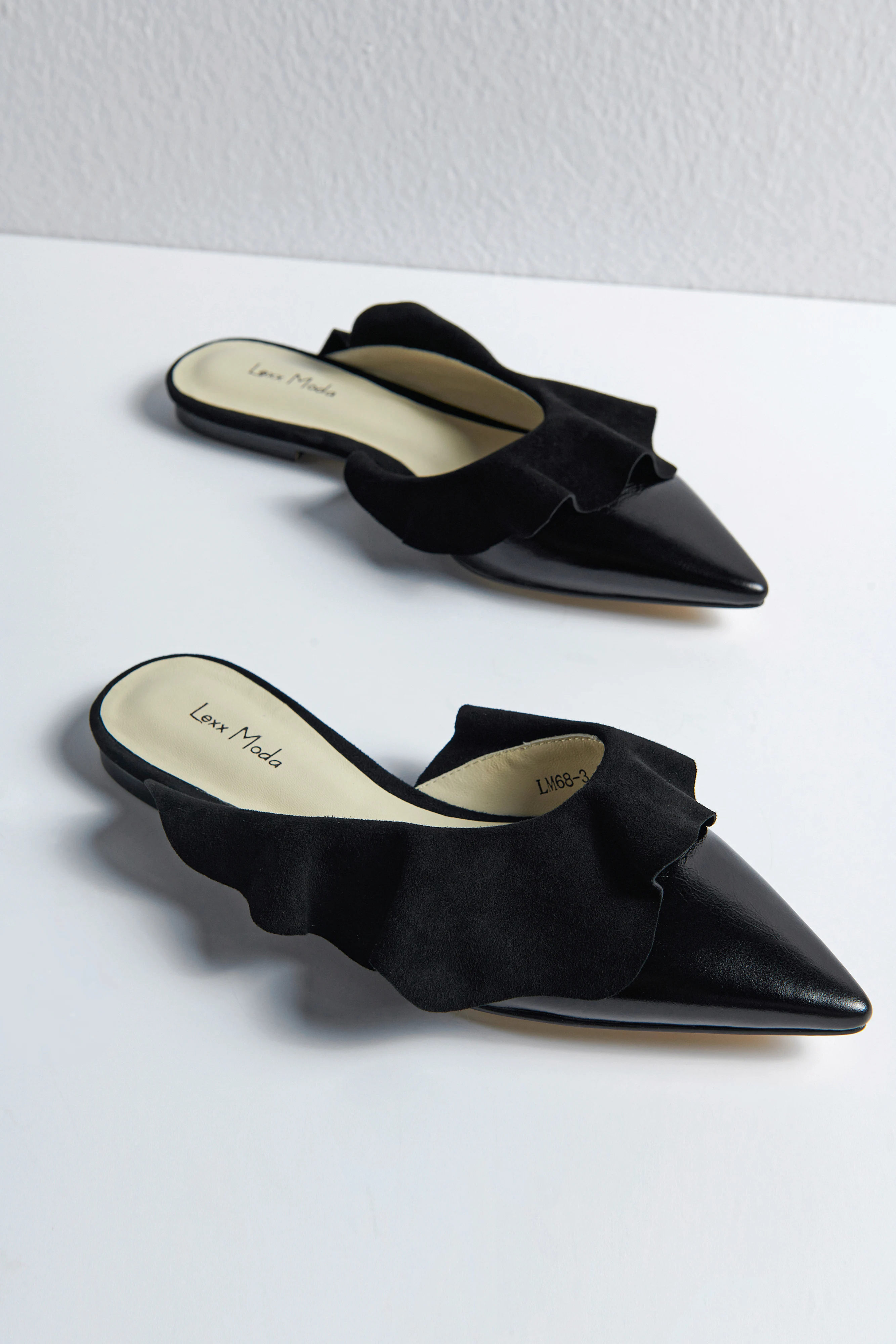 

Black Cowhide Leather Pointed Toe Mules Genuine Lambskin Ruffle Edge Slip-On Flats with Handcrafted Detailed Microfiber Insole