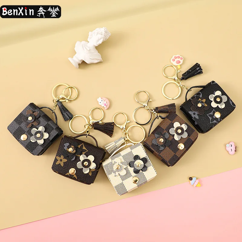 Miniso leather flower earphone case keychain pendant, cute monogram girl bag key chain