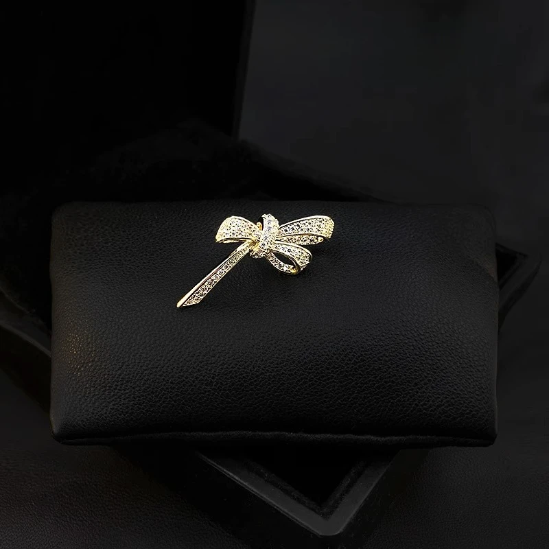 

Elegant Bowknot Brooch for Women Golden Rhinestone Accented Anti-Exposure Clasp Small Sophisticated Accessory Jewelry Pin 3529