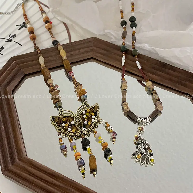 

Natural Stone Butterfly Beaded Necklace With Unique Design Sense, Ethnic Style Splicing, Peacock Tassel Sweater Chain For Women